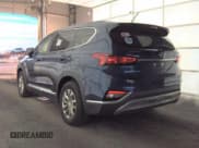 ✅ 2019 Hyundai Santa Fe SE • VIN: 5NMS2CAD0KH114542 • Lot: 92744135. Listed on Copart with 93,947 mi. Free auction sales archive from the USA and detailed vehicle history report at DreamBid. Image 3.