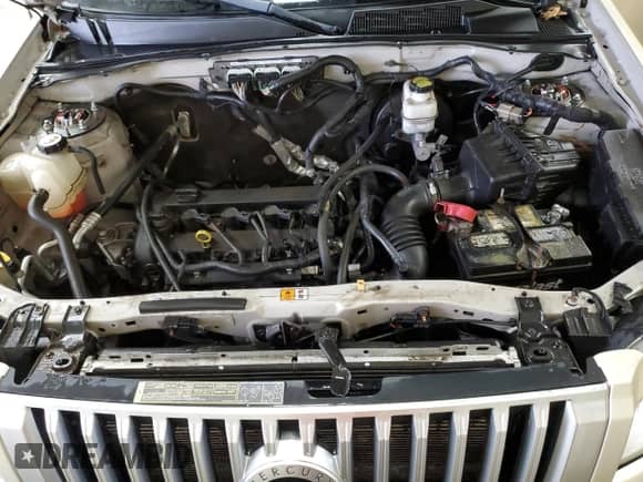 2011 Mercury Mariner z VIN 4M2CN8B78BKJ06091, wystawiony jako Copart lot #55331835 z przebiegiem 167 484 mil mil oraz Czysty tytuł • Clean title. Historia ofert i sprzedaży dostępna na DreamBid. Obrazek 12.