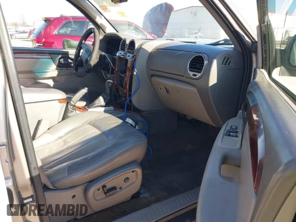 ✅ 2003 GMC Envoy SLE • VIN: 1GKES16S536164428 • Lot: 41728922. Listed on IAAI with 268,309 mi. Free auction sales archive from the USA and detailed vehicle history report at DreamBid. Image 5.