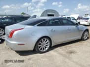 ✅ 2015 Jaguar XJ • VIN: SAJWJ1CD1F8V75232 • Lot: 57605685. Listed on Copart with 146,314 mi. Free auction sales archive from the USA and detailed vehicle history report at DreamBid. Image 3.