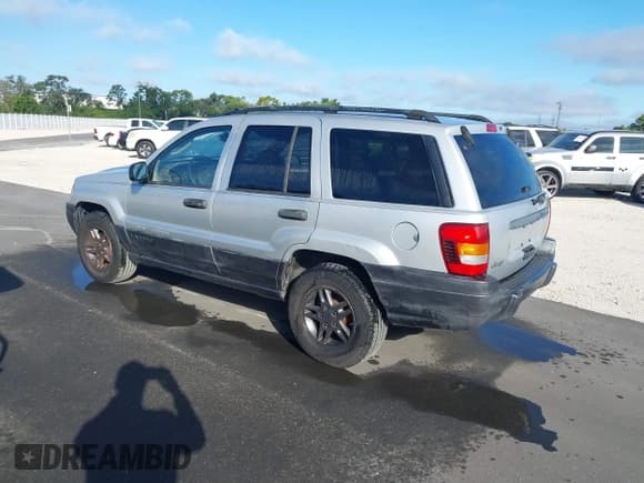 ✅ 2004 Jeep Grand Cherokee Laredo • VIN: 1J4GX48SX4C360639 • Lot: 43402545. Listed on IAAI with 217,717 mi. Free auction sales archive from the USA and detailed vehicle history report at DreamBid. Image 3.