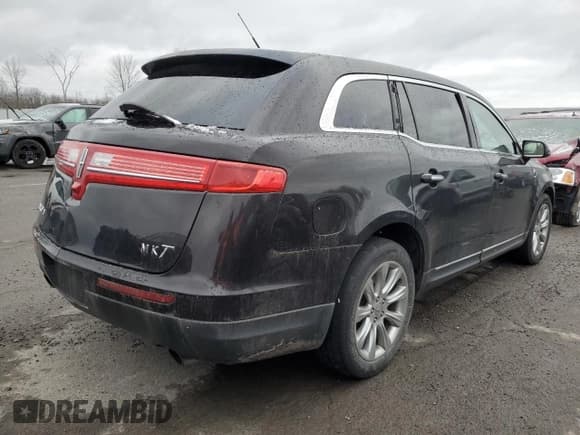 ✅ 2014 Lincoln MKT • VIN: 2LMHJ5FK9EBL50142 • Lot: 85564374. Listed on Copart with 180,263 mi. Free auction sales archive from the USA and detailed vehicle history report at DreamBid. Image 3.