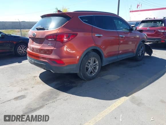 2018 Hyundai Santa Fe 2.4L z VIN 5XYZU3LB8JG523000, wystawiony jako IAAI lot #43263685 z przebiegiem 96 480 mil mil oraz . Historia ofert i sprzedaży dostępna na DreamBid. Obrazek 4.