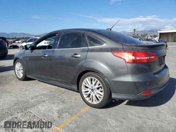 ✅ 2015 Ford Focus Titanium • VIN: 1FADP3J24FL387048 • Lot: 82431245. Listed on Copart with 124,984 mi. Free auction sales archive from the USA and detailed vehicle history report at DreamBid. Image 2.