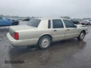 ✅ 1997 Lincoln Town Car Signature • VIN: 1LNLM82W1VY730912 • Lot: 73215014. Listed on Copart with 194,457 mi. Free auction sales archive from the USA and detailed vehicle history report at DreamBid. Image 3.