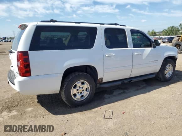2010 Chevrolet Suburban LT z VIN 1GNUKJE33AR260045, wystawiony jako Copart lot #71088865 z przebiegiem Nie podano mil oraz Szkoda całkowita • Salvage title. Historia ofert i sprzedaży dostępna na DreamBid. Obrazek 3.