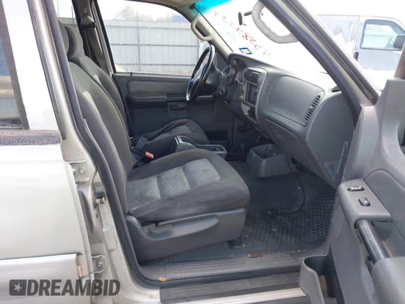 ✅ 2004 Ford Explorer Sport Trac XLS • VIN: 1FMZU77K34UA65740 • Lot: 43589534. Listed on IAAI with 310,281 mi. Free auction sales archive from the USA and detailed vehicle history report at DreamBid. Image 5.