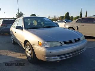 ✅ 2000 Toyota Corolla VE • VIN: 1NXBR12E4YZ358411 • Lot: 43792986. Listed on IAAI with 185,715 mi. Free auction sales archive from the USA and detailed vehicle history report at DreamBid. Image 1.