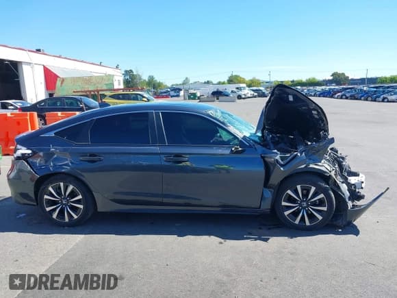 ✅ 2022 Honda Civic EX-L • VIN: 19XFL1H7XNE013345 • Lot: 42064892. Listed on IAAI with 23,223 mi. Free auction sales archive from the USA and detailed vehicle history report at DreamBid. Image 14.