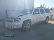 ✅ 2014 Chevrolet Suburban LTZ • VIN: 1GNSKKE7XER142130 • Lot: 43595884. Listed on IAAI with 165,414 mi. Free auction sales archive from the USA and detailed vehicle history report at DreamBid. Image 2.