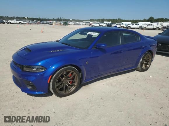 ✅ 2022 Dodge Charger SRT Hellcat Widebody • VIN: 2C3CDXL97NH159335 • Lot: 74745504. Listed on Copart with 13,630 mi. Free auction sales archive from the USA and detailed vehicle history report at DreamBid. Image 1.