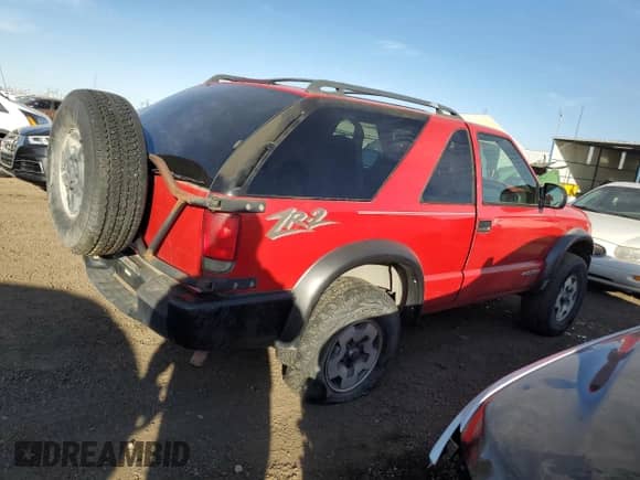 2004 Chevrolet Blazer LS with VIN 1GNCT18X34K141674, listed as a Copart auction lot 85500954 with Not provided miles and Clean title. Bid and sale history available at DreamBid. Image 3.