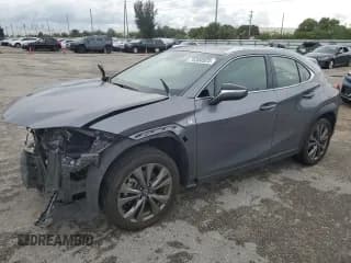 ✅ 2021 Lexus UX 200 F Sport • VIN: JTHE3JBH3M2039874 • Лот: 76300523. Опубликован ранее на Copart с пробегом 14 330 миль. Бесплатный доступ к архиву аукционных продаж из США и подробный отчёт об истории автомобиля на DreamBid. Изображение 1.