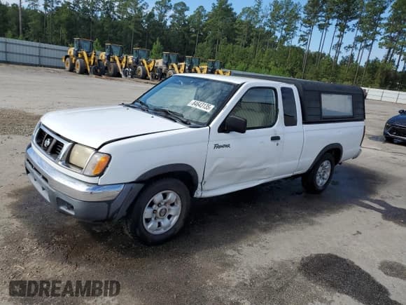 ✅ 1998 Nissan Frontier XE • VIN: 1N6DD26S5WC311065 • Lot: 84643135. Listed on Copart with 212,985 mi. Free auction sales archive from the USA and detailed vehicle history report at DreamBid. Image 1.