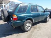 ✅ 1999 Honda Passport LX • VIN: 4S6CK58W7X4402777 • Лот: 43107052. Опубликован ранее на IAAI с пробегом 201 865 миль. Бесплатный доступ к архиву аукционных продаж из США и подробный отчёт об истории автомобиля на DreamBid. Изображение 4.