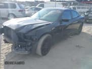 ✅ 2014 Dodge Charger Road/Track • VIN: 2C3CDXCTXEH167697 • Lot: 43308573. Listed on IAAI with 151,471 mi. Free auction sales archive from the USA and detailed vehicle history report at DreamBid. Image 2.