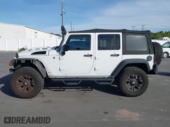 ✅ 2014 Jeep Wrangler Unlimited Sport • VIN: 1C4BJWDG1EL154948 • Лот: 43674003. Опубликован ранее на IAAI с пробегом 101 988 миль. Бесплатный доступ к архиву аукционных продаж из США и подробный отчёт об истории автомобиля на DreamBid. Изображение 14.