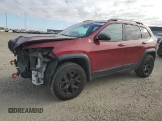 ✅ 2015 Jeep Cherokee Trailhawk • VIN: 1C4PJMBS9FW697689 • Lot: 85923985. Wystawiony na Copart z przebiegiem 166 759 mil. Bezpłatny archiwum sprzedaży aukcyjnych z USA i szczegółowy raport historii pojazdu na DreamBid. Zdjęcie 1.