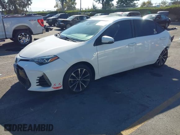 ✅ 2018 Toyota Corolla SE • VIN: 5YFBURHE4JP761316 • Lot: 43527152. Listed on IAAI with 153,020 mi. Free auction sales archive from the USA and detailed vehicle history report at DreamBid. Image 2.