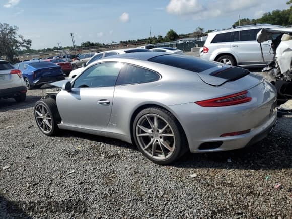 ✅ 2017 Porsche 911 Carrera • VIN: WP0AA2A99HS106537 • Lot: 61464305. Listed on Copart with 63,078 mi. Free auction sales archive from the USA and detailed vehicle history report at DreamBid. Image 2.