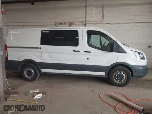 ✅ 2015 Ford Transit Cargo • VIN: 1FTNE1YG9FKB08497 • Lot: 42106682. Listed on IAAI with 158,992 mi. Free auction sales archive from the USA and detailed vehicle history report at DreamBid. Image 13.