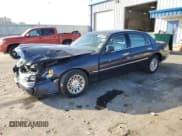 ✅ 1999 Lincoln Town Car Signature • VIN: 1LNHM82W9XY691057 • Lot: 90223875. Listed on Copart with 200,691 mi. Free auction sales archive from the USA and detailed vehicle history report at DreamBid. Image 1.