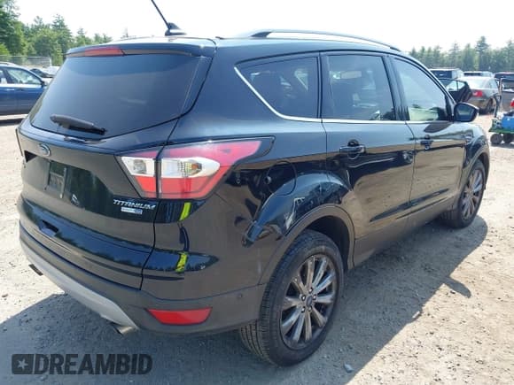 ✅ 2018 Ford Escape Titanium • VIN: 1FMCU9J9XJUA58366 • Lot: 42941884. Listed on IAAI with 157,052 mi. Free auction sales archive from the USA and detailed vehicle history report at DreamBid. Image 4.