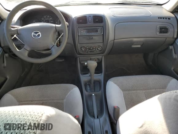 ✅ 2000 Mazda Protege DX • VIN: JM1BJ2220Y0239835 • Lot: 80228864. Wystawiony na Copart z przebiegiem 200 936 mil. Bezpłatny archiwum sprzedaży aukcyjnych z USA i szczegółowy raport historii pojazdu na DreamBid. Zdjęcie 8.