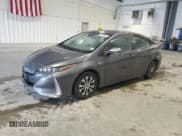 ✅ 2021 Toyota Prius XLE • VIN: JTDKAMFP6M3174970 • Lot: 85478855. Listed on Copart with 69,387 mi. Free auction sales archive from the USA and detailed vehicle history report at DreamBid. Image 1.