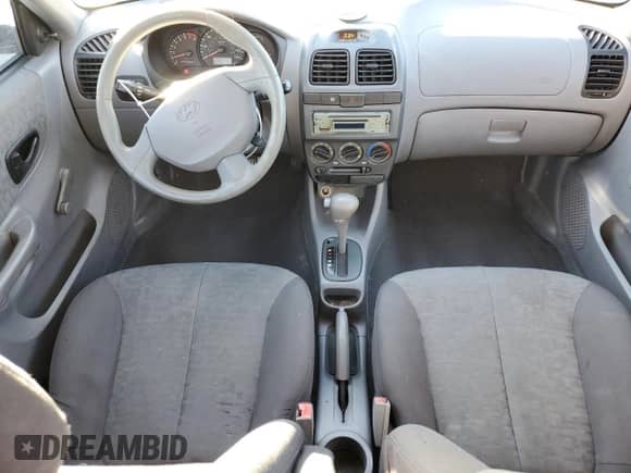2005 Hyundai Accent GLS with VIN KMHCG45C95U665574, listed as a Copart auction lot 82603804 with 154,187 mi miles and Salvage title. Bid and sale history available at DreamBid. Image 8.