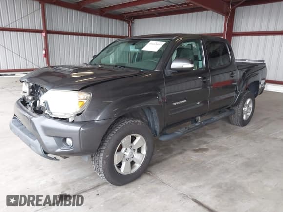✅ 2015 Toyota Tacoma • VIN: 3TMLU4EN6FM198795 • Lot: 41612057. Listed on IAAI with 103,001 mi. Free auction sales archive from the USA and detailed vehicle history report at DreamBid. Image 2.