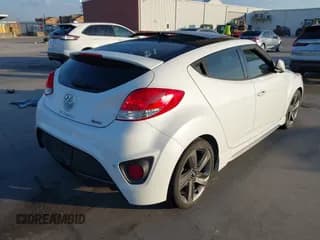 ✅ 2014 Hyundai Veloster Turbo • VIN: KMHTC6AE9EU201750 • Lot: 40691529. Wystawiony na IAAI z przebiegiem 87 958 mil. Bezpłatny archiwum sprzedaży aukcyjnych z USA i szczegółowy raport historii pojazdu na DreamBid. Zdjęcie 4.