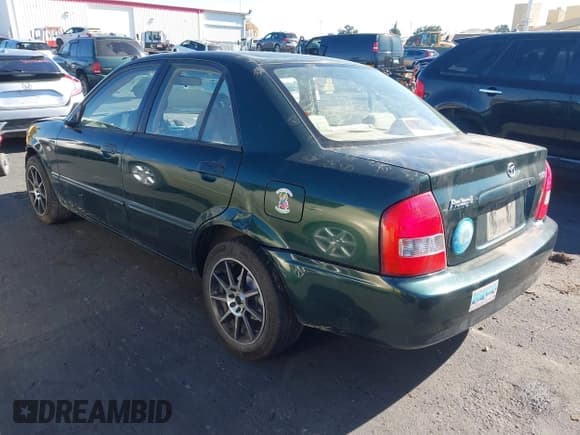 ✅ 2002 Mazda Protege DX • VIN: JM1BJ225021620967 • Lot: 43484388. Wystawiony na IAAI z przebiegiem 200 574 mil. Bezpłatny archiwum sprzedaży aukcyjnych z USA i szczegółowy raport historii pojazdu na DreamBid. Zdjęcie 3.
