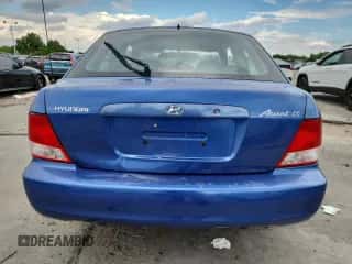 2002 Hyundai Accent GS z VIN KMHCG35C22U161535, wystawiony jako Copart lot #70580195 z przebiegiem 74 007 mil mil oraz Szkoda całkowita • Salvage title. Historia ofert i sprzedaży dostępna na DreamBid. Obrazek 6.