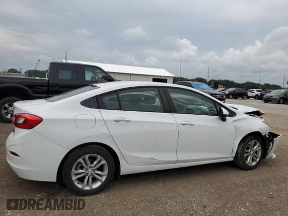 ✅ 2019 Chevrolet Cruze LS • VIN: 1G1BC5SM1K7132734 • Lot: 67776215. Listed on Copart with 128,735 mi. Free auction sales archive from the USA and detailed vehicle history report at DreamBid. Image 3.
