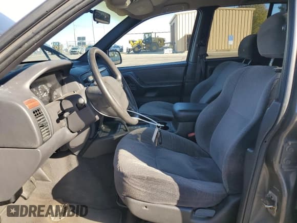 ✅ 1999 Jeep Grand Cherokee Laredo • VIN: 1J4GW58S9XC723378 • Lot: 90095705. Listed on Copart with 177,816 mi. Free auction sales archive from the USA and detailed vehicle history report at DreamBid. Image 7.
