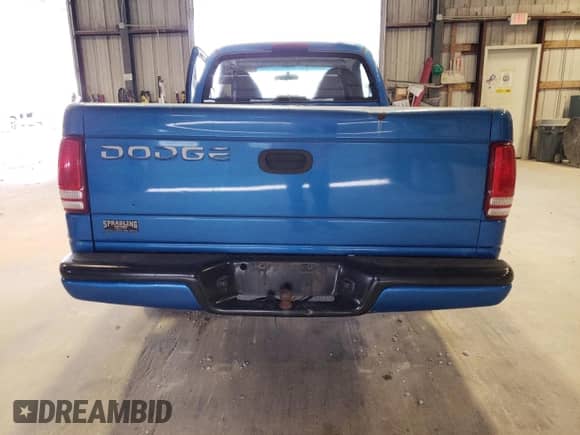 1999 Dodge Dakota SLT z VIN 1B7FL26X0XS298131, wystawiony jako Copart lot #69590254 z przebiegiem 162 606 mil mil oraz Szkoda całkowita • Salvage title. Historia ofert i sprzedaży dostępna na DreamBid. Obrazek 6.