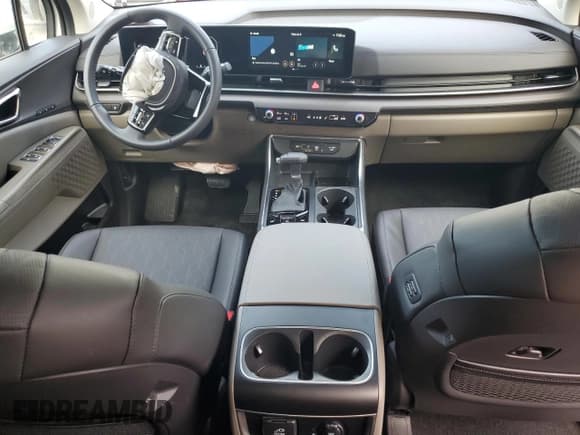 ✅ 2025 Kia Carnival SX • VIN: KNDNE5K31S6518999 • Лот: 64270185. Опубликован ранее на Copart с пробегом 2 283 миль. Бесплатный доступ к архиву аукционных продаж из США и подробный отчёт об истории автомобиля на DreamBid. Изображение 8.
