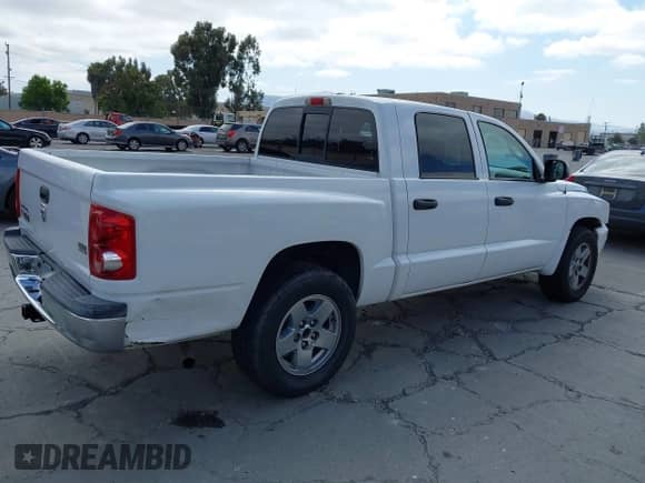 2006 Dodge Dakota SLT with VIN 1D7HE48N26S698223, listed as a IAAI auction lot 42586220 with 100,548 mi miles and . Bid and sale history available at DreamBid. Image 4.