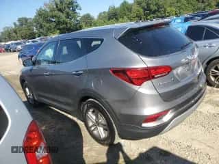 2018 Hyundai Santa Fe 2.4L z VIN 5XYZT3LB7JG559148, wystawiony jako Copart lot #84760925 z przebiegiem 147 179 mil mil oraz Czysty tytuł • Clean title. Historia ofert i sprzedaży dostępna na DreamBid. Obrazek 2.