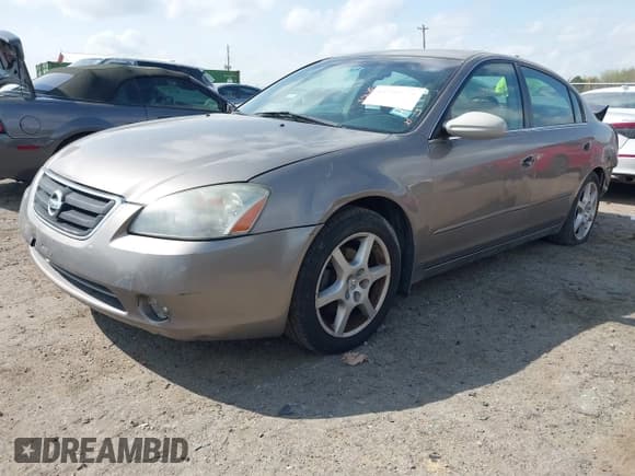 ✅ 2003 Nissan Altima SE • VIN: 1N4BL11DX3C331331 • Lot: 41908824. Listed on IAAI with 115,026 mi. Free auction sales archive from the USA and detailed vehicle history report at DreamBid. Image 2.