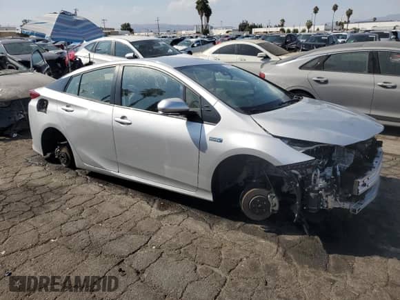 2022 Toyota Prius LE с VIN JTDKAMFP7N3228892, выставлен на аукционе Copart как лот 69565485 с пробегом 23 576 миль миль и Списание • Salvage title. История ставок и продаж доступна на DreamBid. Изображение 4.