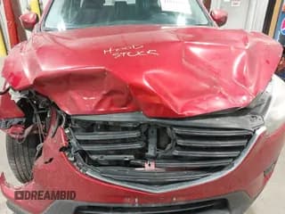 ✅ 2016 Mazda CX-5 Sport • VIN: JM3KE4BY1G0618658 • Lot: 42839303. Listed on IAAI with 234,137 mi. Free auction sales archive from the USA and detailed vehicle history report at DreamBid. Image 6.