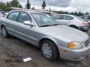 ✅ 2004 Kia Optima LX • VIN: KNAGD126545362194 • Лот: 42910648. Опубликован ранее на IAAI с пробегом 169 022 миль. Бесплатный доступ к архиву аукционных продаж из США и подробный отчёт об истории автомобиля на DreamBid. Изображение 1.