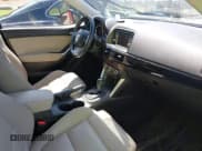 ✅ 2014 Mazda CX-5 Grand Touring • VIN: JM3KE2DY3E0339601 • Lot: 42652114. Wystawiony na IAAI z przebiegiem 153 063 mil. Bezpłatny archiwum sprzedaży aukcyjnych z USA i szczegółowy raport historii pojazdu na DreamBid. Zdjęcie 5.