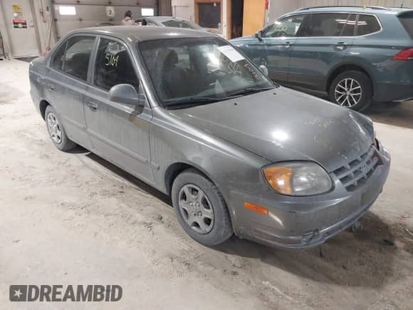 2004 Hyundai Accent GL z VIN KMHCG45C44U528783, wystawiony jako IAAI lot #41535104 z przebiegiem Nie podano mil oraz . Historia ofert i sprzedaży dostępna na DreamBid. Obrazek 1.