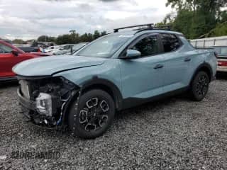 2023 Hyundai Santa Cruz SEL z VIN 5NTJC4AE6PH048985, wystawiony jako Copart lot #70263855 z przebiegiem 23 451 mil mil oraz Nie do naprawy • Non repairable. Historia ofert i sprzedaży dostępna na DreamBid. Obrazek 1.