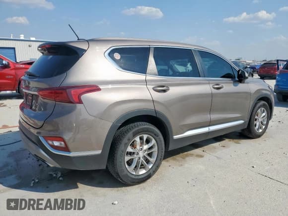 ✅ 2019 Hyundai Santa Fe SE • VIN: 5NMS23ADXKH097314 • Lot: 80940485. Listed on Copart with 114,759 mi. Free auction sales archive from the USA and detailed vehicle history report at DreamBid. Image 3.