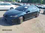 2023 Toyota Camry SE with VIN 4T1G11BKXPU097643, listed as a IAAI auction lot 42833306 with 23,580 mi miles and . Bid and sale history available at DreamBid. Image 2.