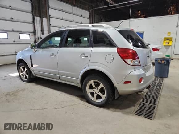 2012 Chevrolet Captiva Sport LTZ with VIN 3GNFL4E59CS592869, listed as a Copart auction lot 90407995 with 174,518 mi miles and Clean title. Bid and sale history available at DreamBid. Image 2.